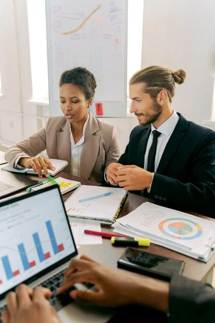 Close-up of various marketing documents on a desk, perfect for business and strategy discussions.